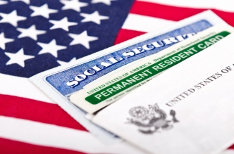 Social Security card and permanent resident on USA flag